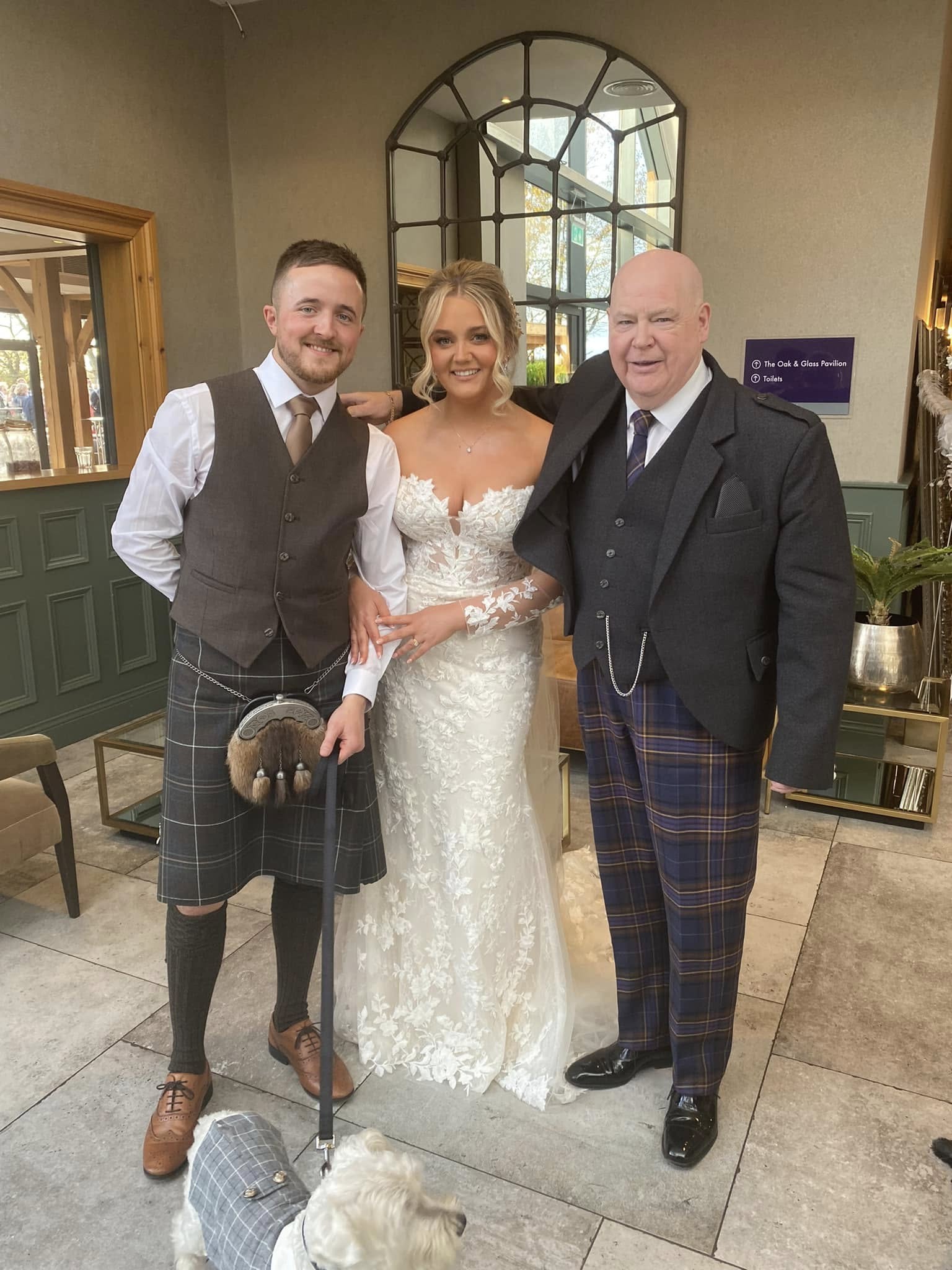 Duncan Fleming with a couple at their Scottish wedding